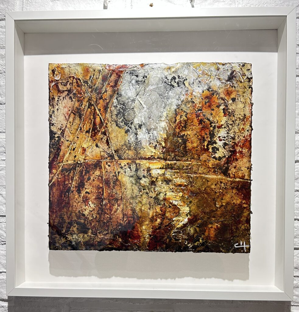 "From Waste to Presence" framed and presented as wall artwork, showing the raw cardboard edges within a white shadow frame